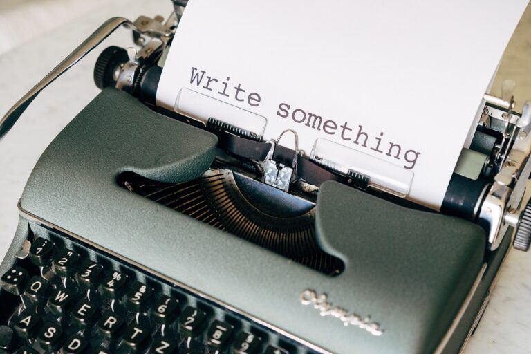 Student writing and planning a college application essay at a desk