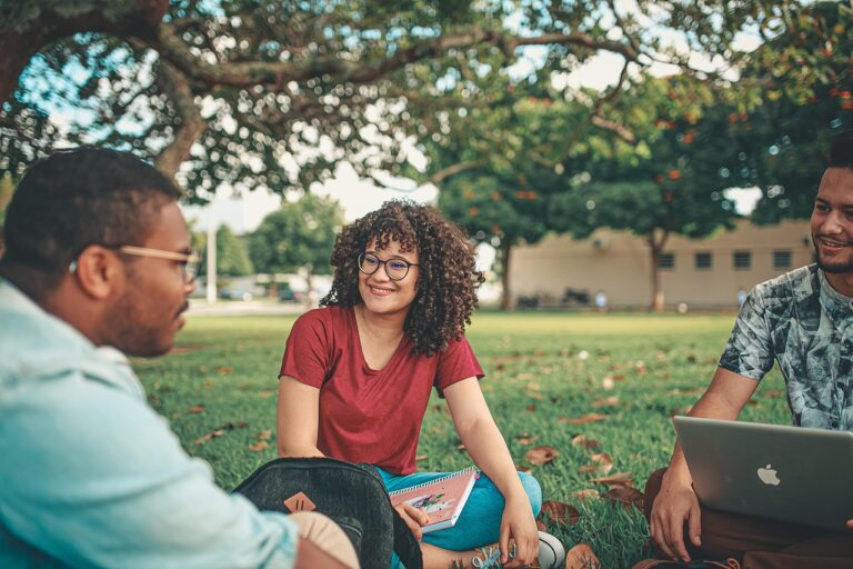 Students walking on a university campus as families evaluate what colleges really offer